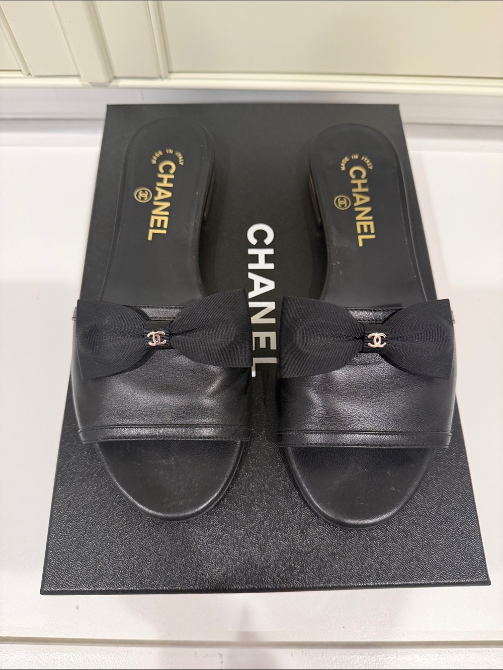CHANEL Black Leather Bow Slide Mules with Gold CC Accent